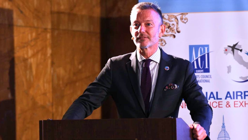 ACI official speaking at podium during Regional Airports Conference & Exhibition