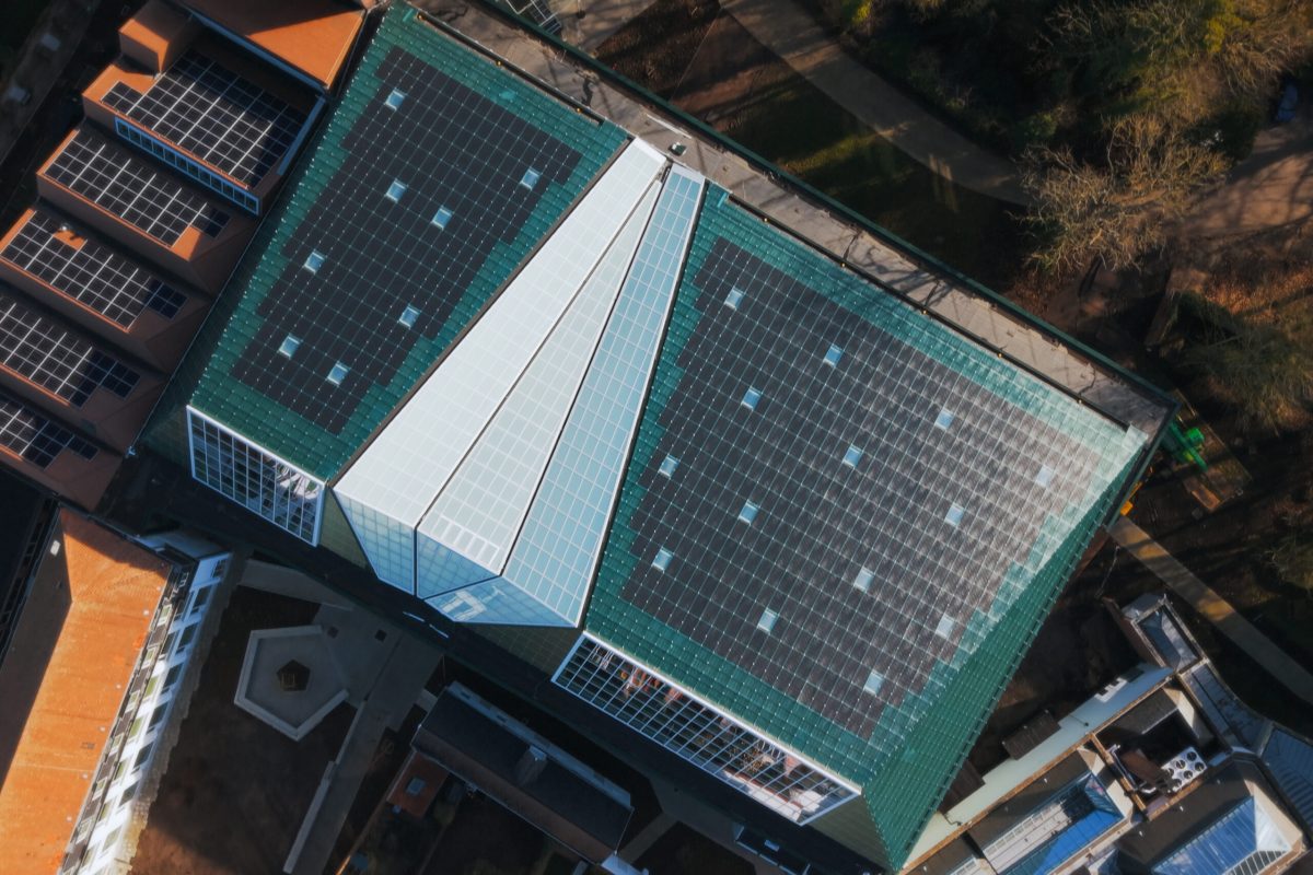Aerial view of BRUSK art hall in Bruges with green roof and solar panels