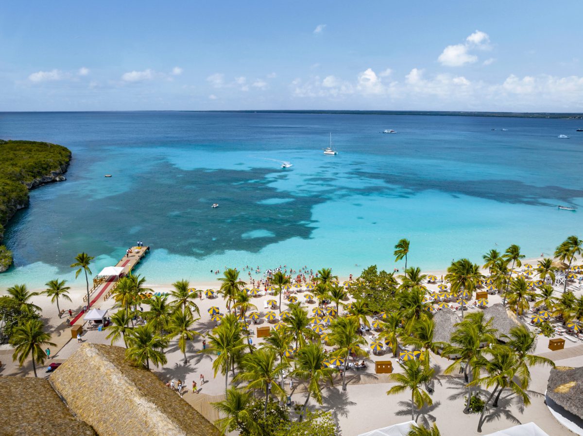 Aerial view of Catalina Sugar Beach with turquoise waters, white sand, and palm trees in Dominican Republic