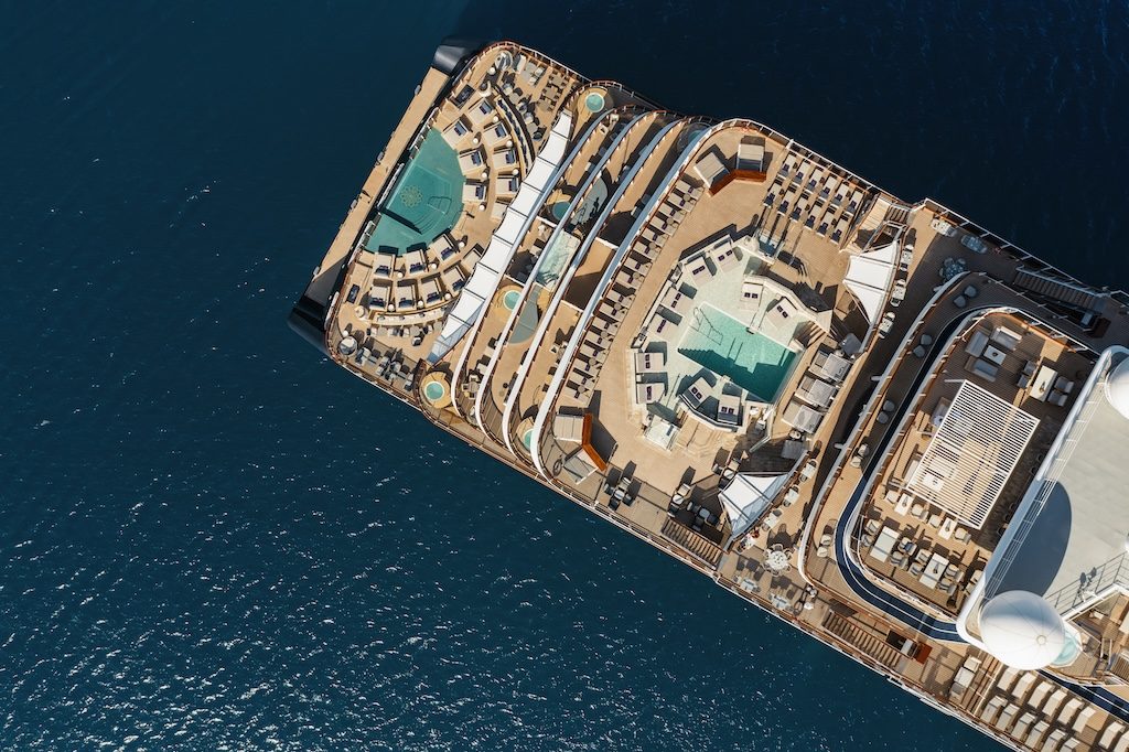 Aerial view of Explora II luxury cruise ship docked in turquoise waters