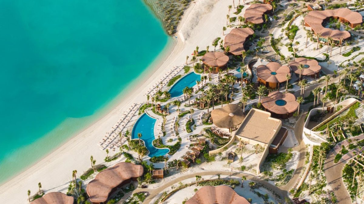 Aerial view of Four Seasons Resort Red Sea with turquoise waters, sandy beach, and luxury buildings