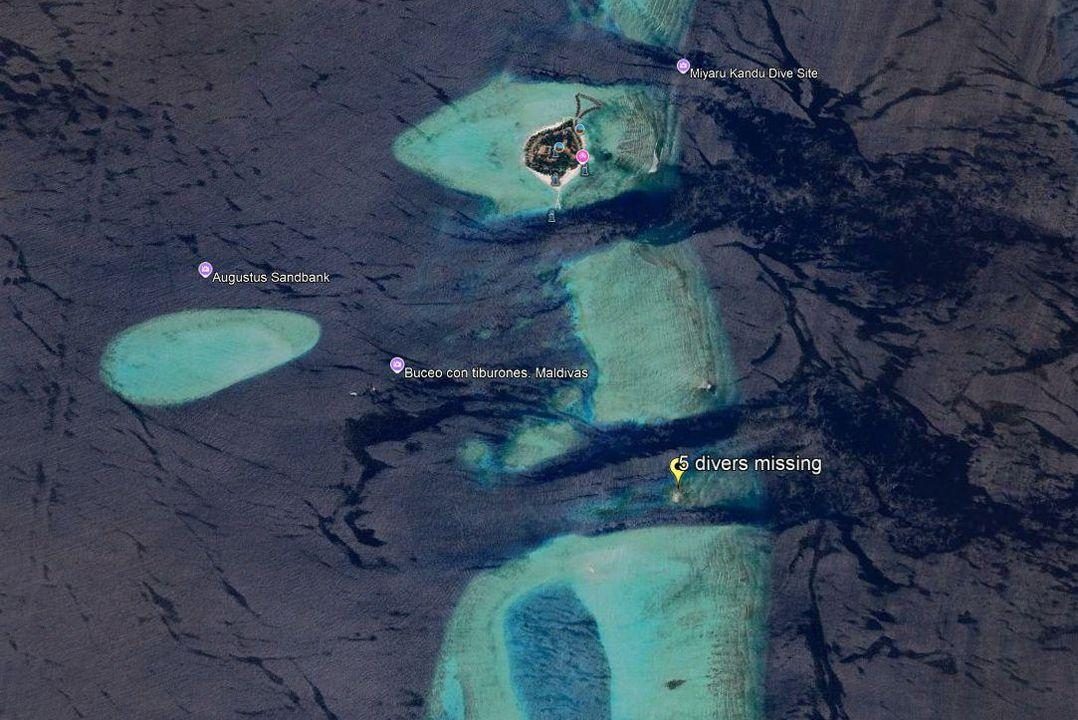 Aerial view of turquoise lagoons and coral formations in the Maldives