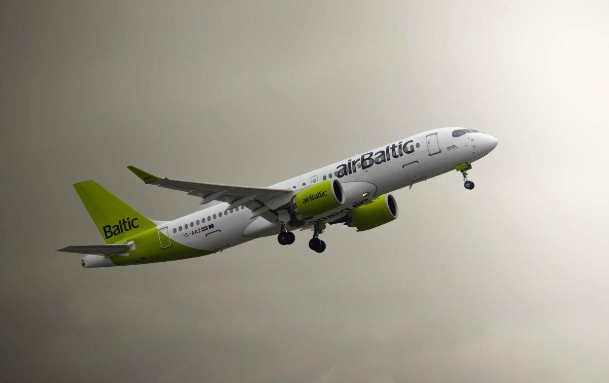 airBaltic Airbus taking off against a cloudy sky.