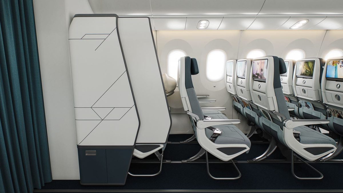 Airplane cabin showing new semi-private middle seat design with privacy barriers