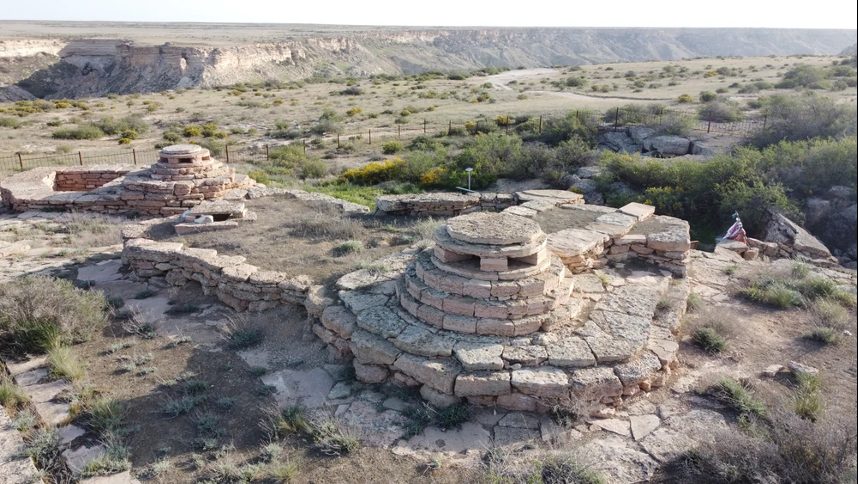 Ancient ruins nestled in a vast, arid landscape in Kazakhstan.