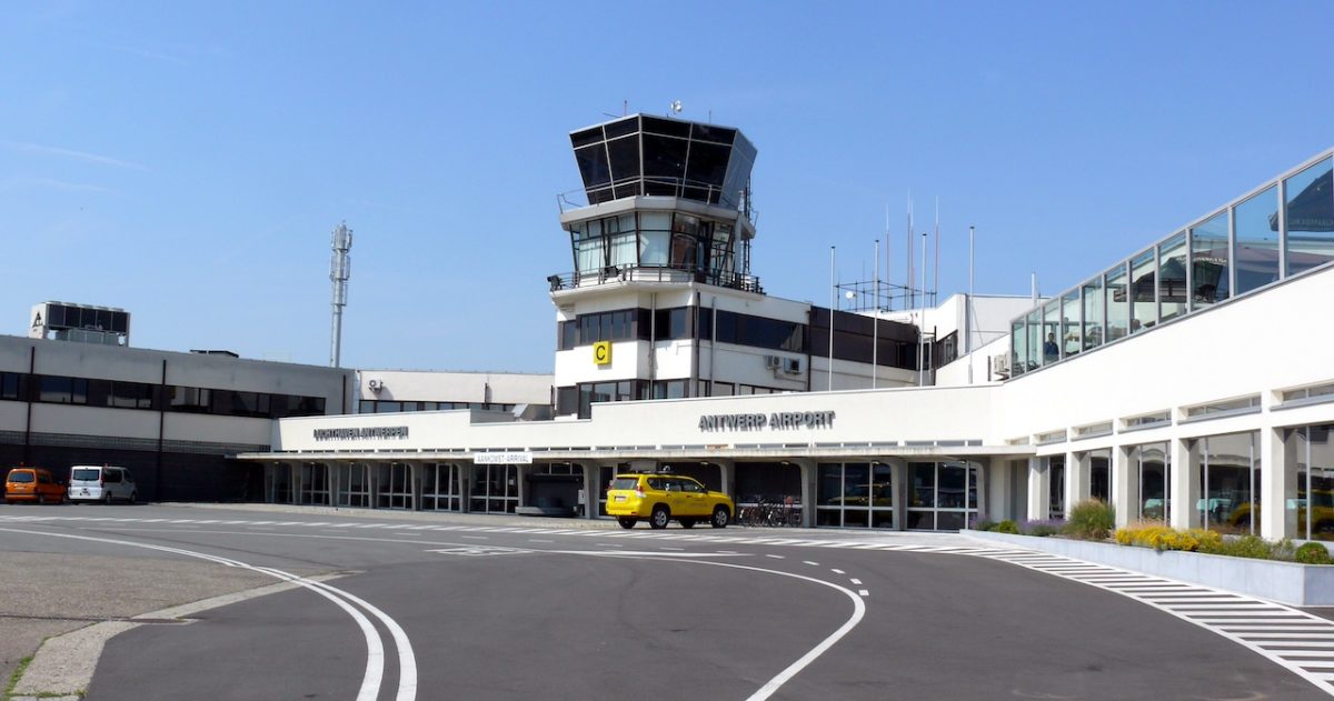 Antwerp Airport terminal building with control tower and empty tarmac