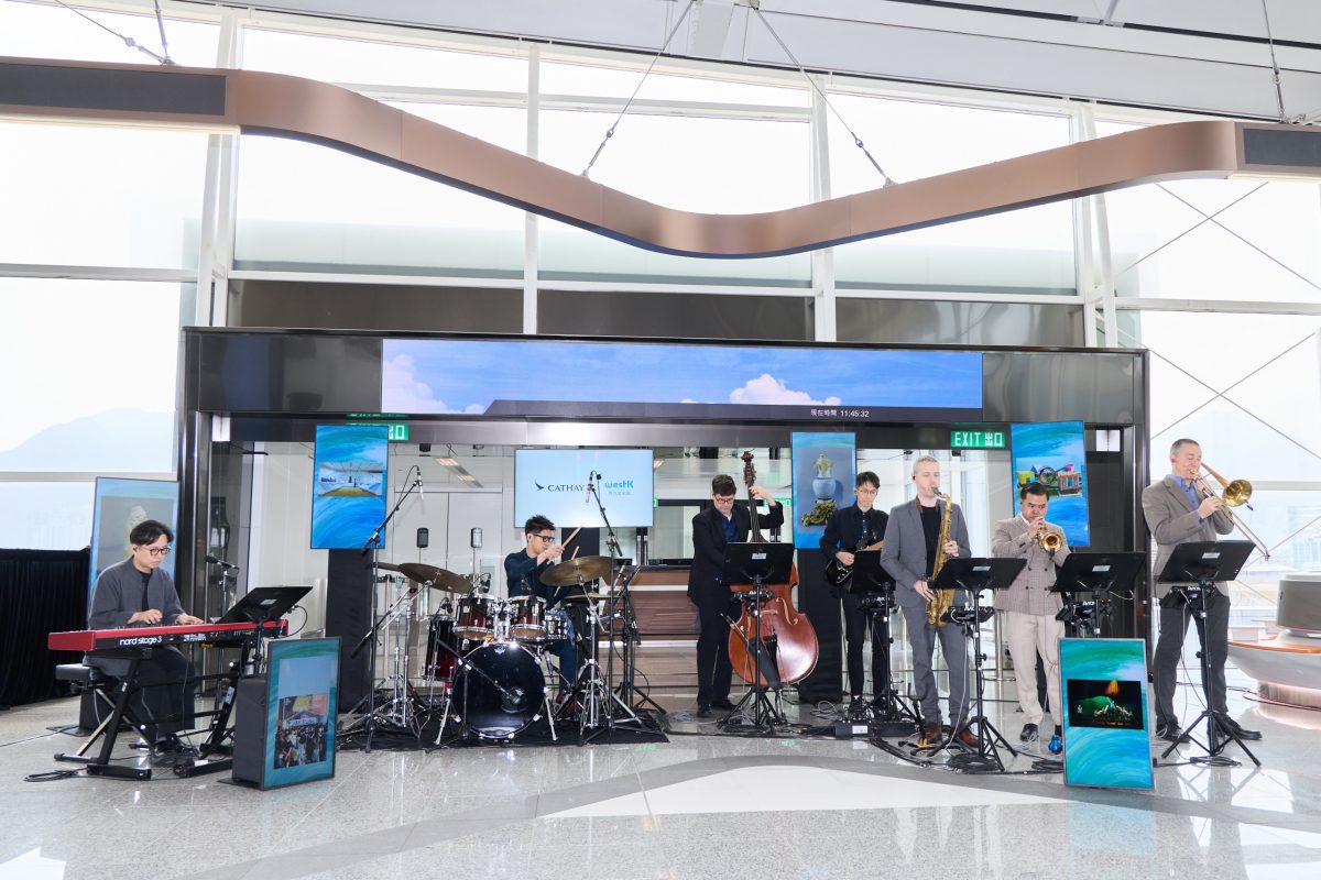 Cathay Pacific band performing at airport terminal during livery unveiling event