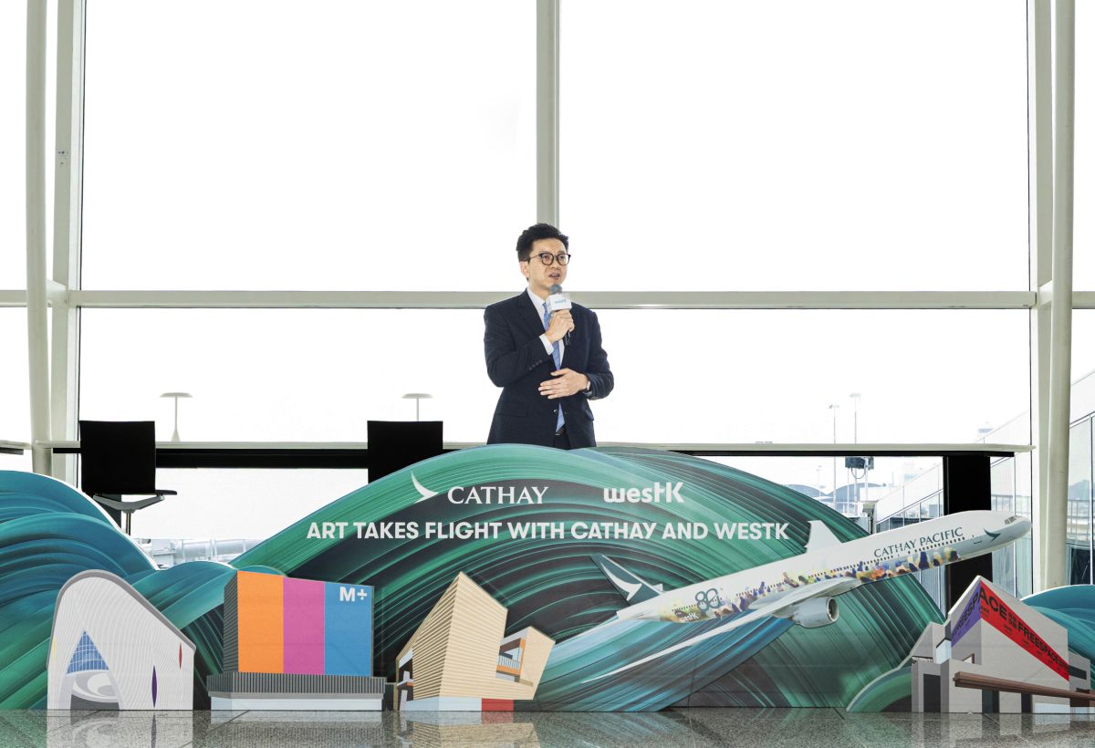 Cathay Pacific executive presenting new Spirit of Hong Kong aircraft livery design