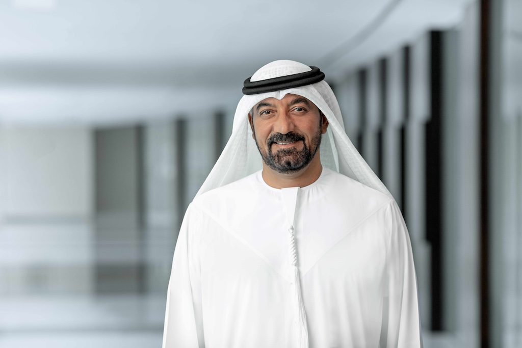 Emirates airline executive in traditional white kandura and ghutra headwear