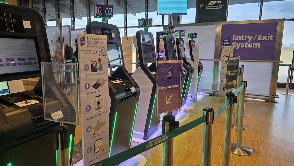 Entry/exit gates at a European airport terminal with digital systems installed