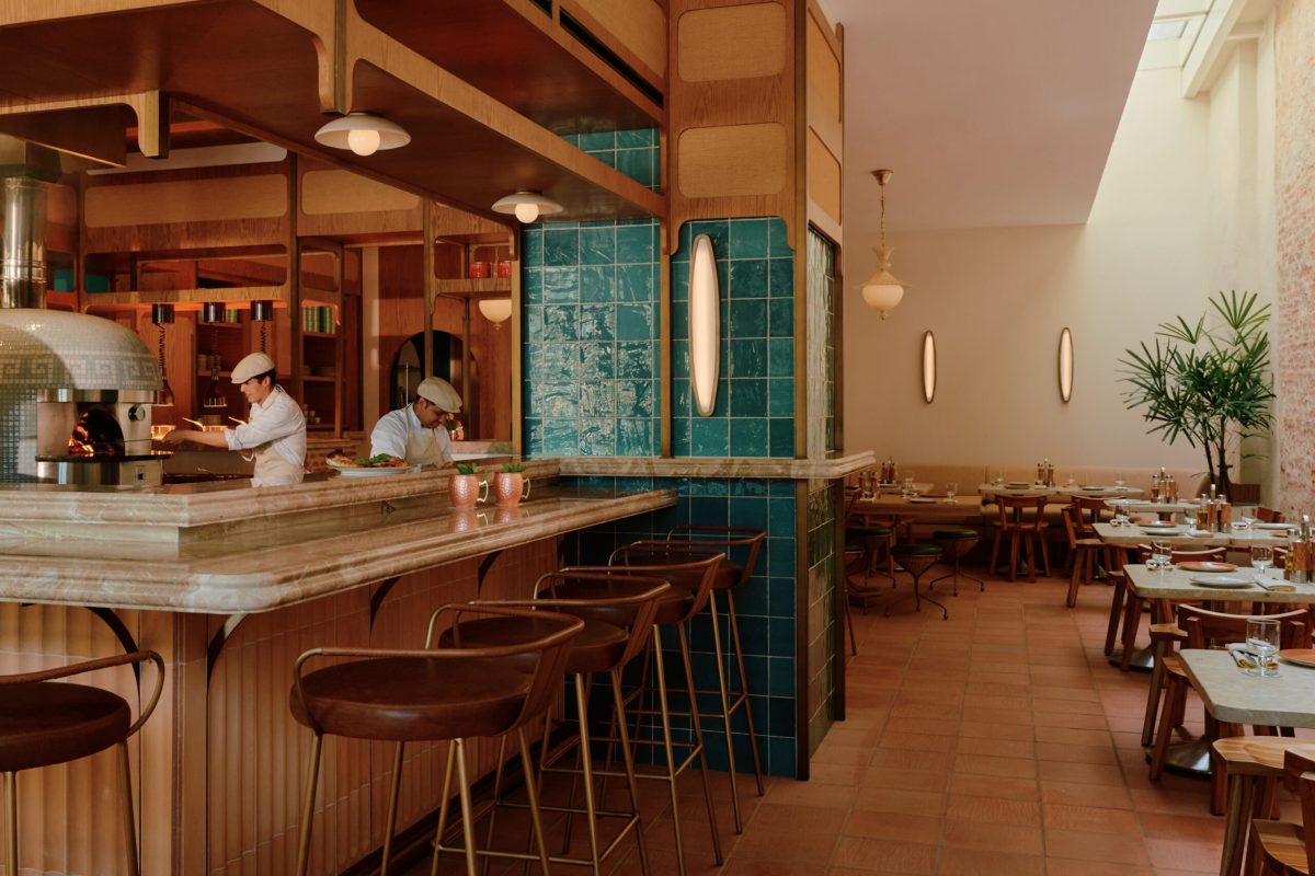 Four Seasons Cartagena restaurant interior with bar seating and teal tile accents