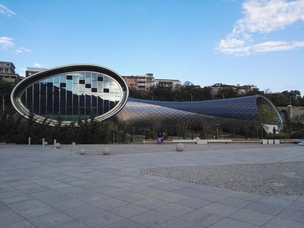 Futuristic Rike Concert Hall with curved metallic design beside River Kura in Tbilisi