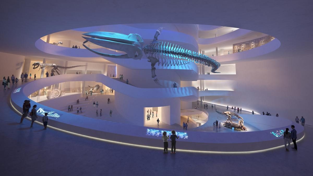 Futuristic spiral museum interior with illuminated whale skeleton and circular walkway