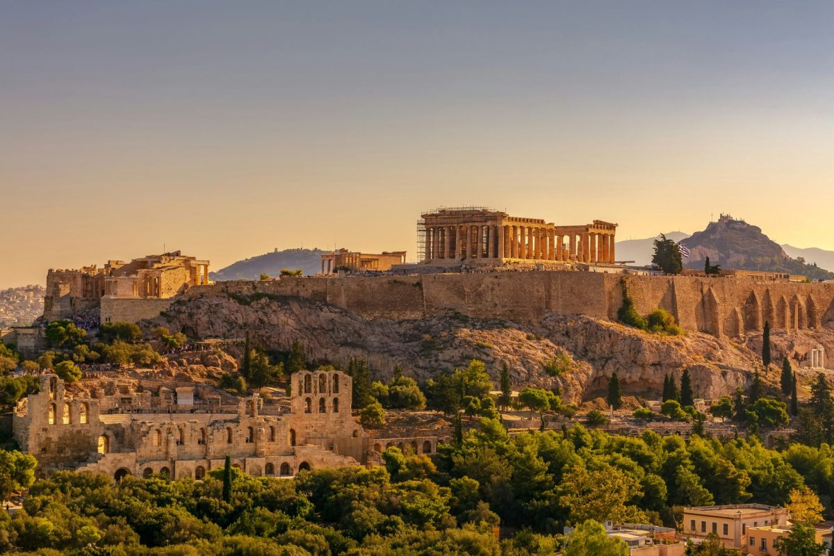 The Acropolis and Parthenon on a hilltop in Athens, Greece at sunset