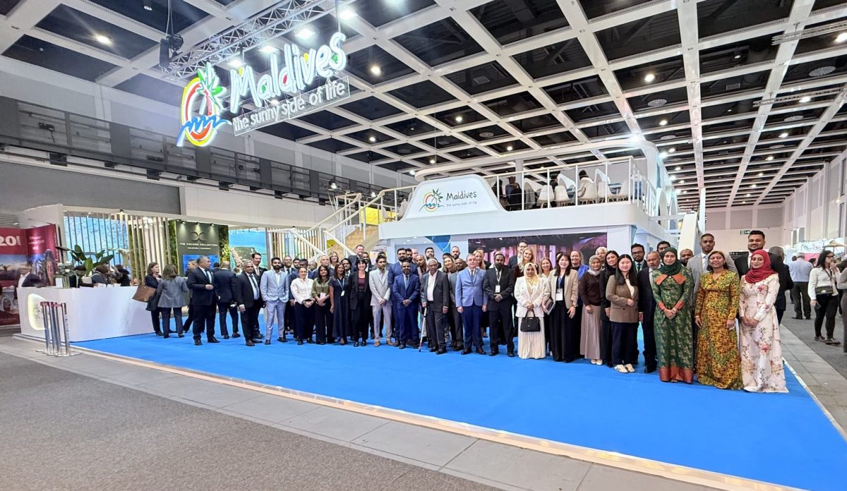 Group photo of officials and delegates at ITB Berlin 2027 Maldives announcement on blue carpet
