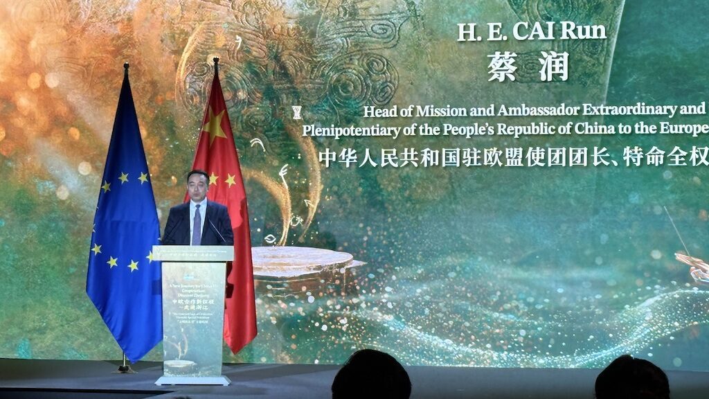 H.E. Cai Run speaks at podium during Zhejiang tourism presentation in Brussels