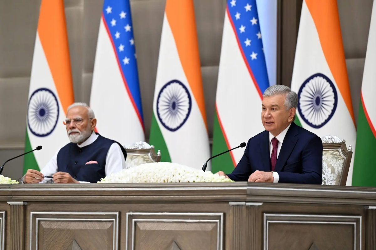 Indian PM Modi and Uzbek President Mirziyoyev at official signing ceremony with flags