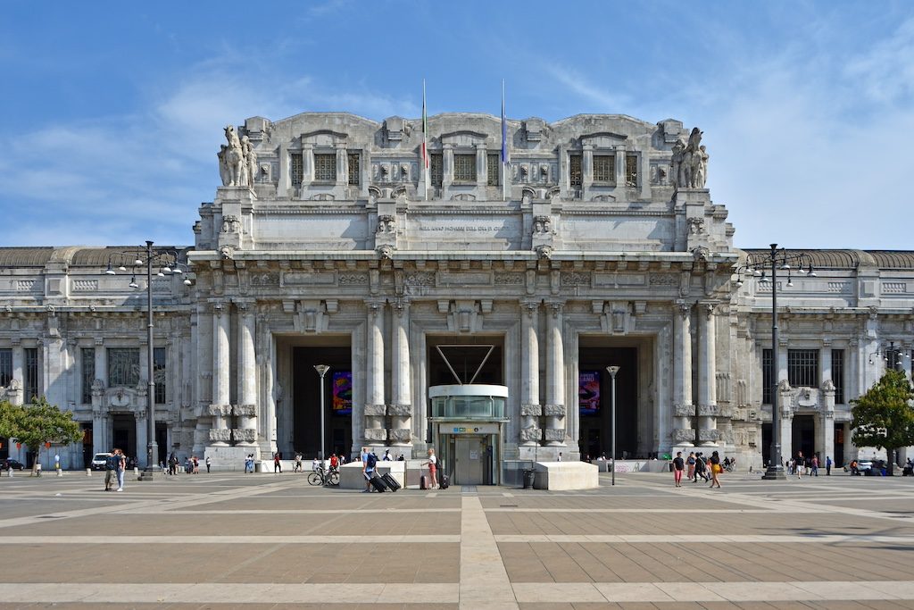 Milano Centrale train station facade with grand columned entrance and ornate architecture