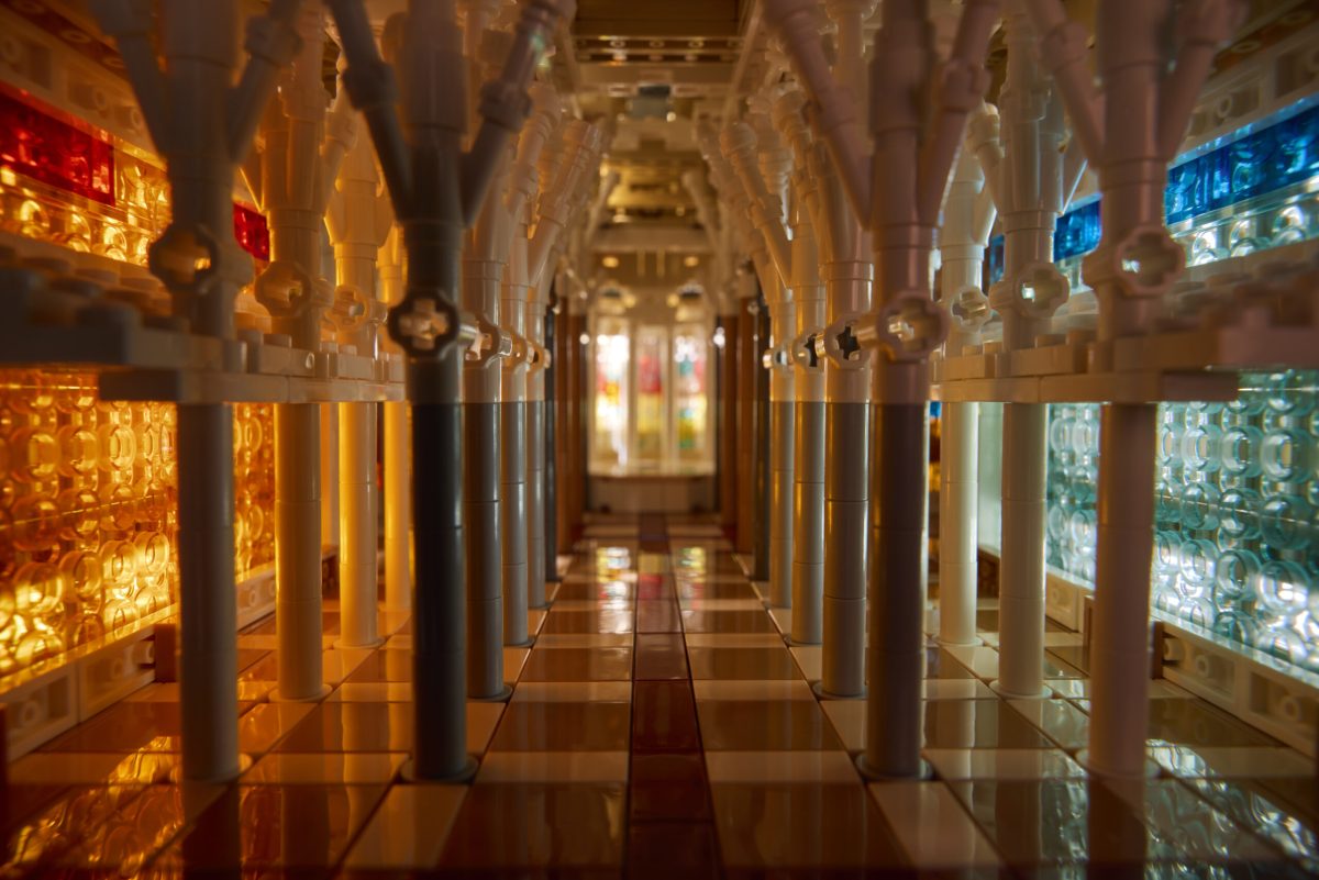 Interior of Sagrada Família basilica with soaring arches and illuminated stained glass windows