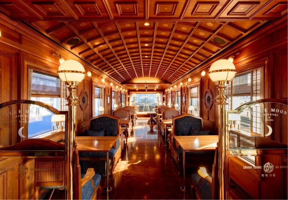 Interior of Seven Stars in Kyushu luxury sleeper train with wooden furnishings and warm lighting