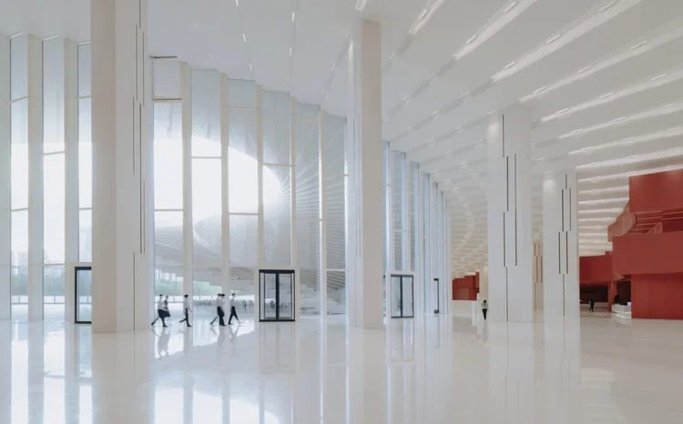 Interior view of Shanghai's Grand Opera House, showcasing its expansive lobby and modern design.