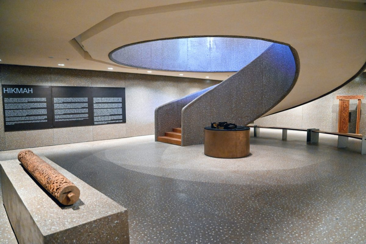 Interior view of the Tashkent art center, showcasing a curved staircase and skylight.