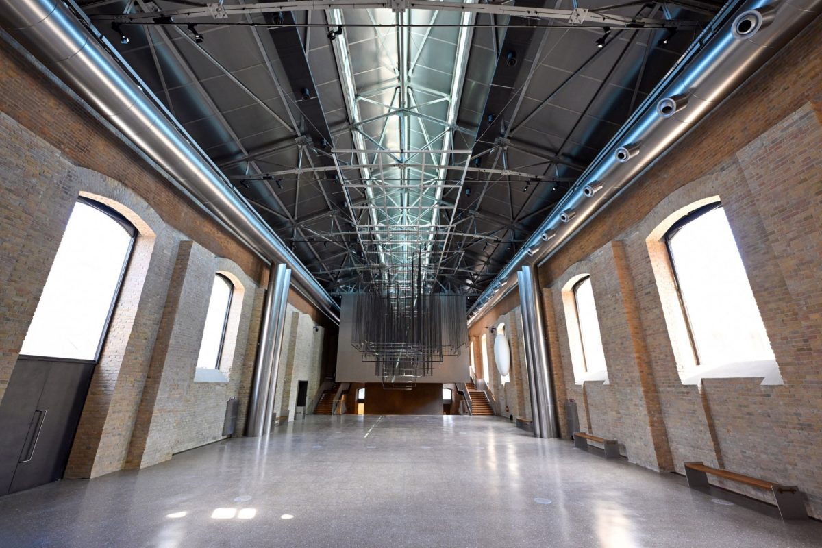 Interior view of the transformed Tashkent tram depot, showcasing its industrial architecture.