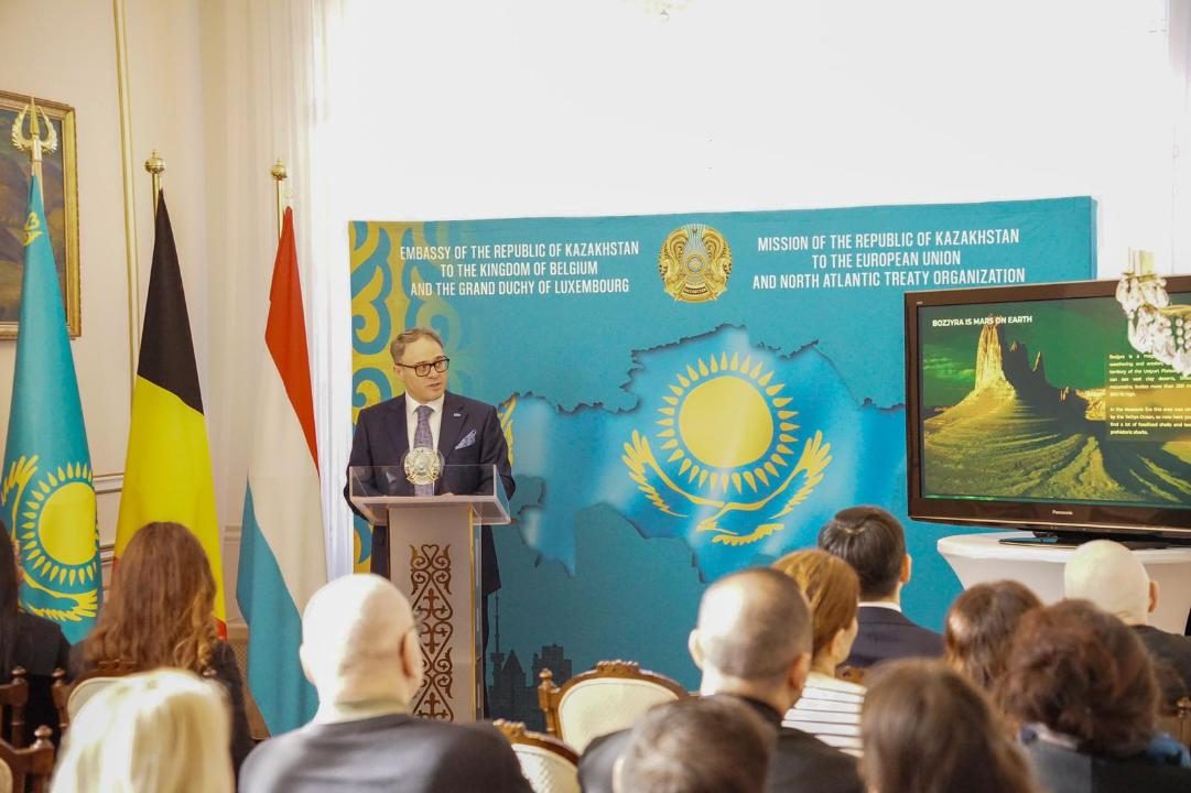 Official presentation about Kazakhstan tourism at international conference with flags and audience
