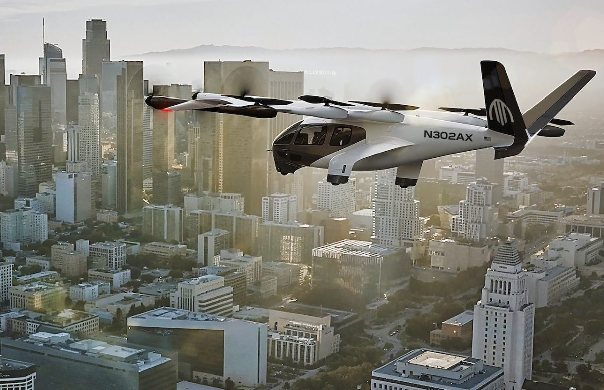Electric air taxi flying over downtown Los Angeles skyline