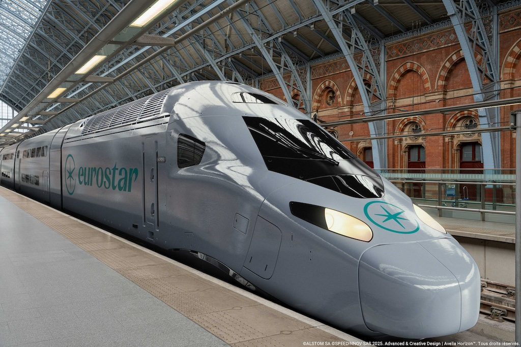 Eurostar high-speed train at a European railway station with historic architecture