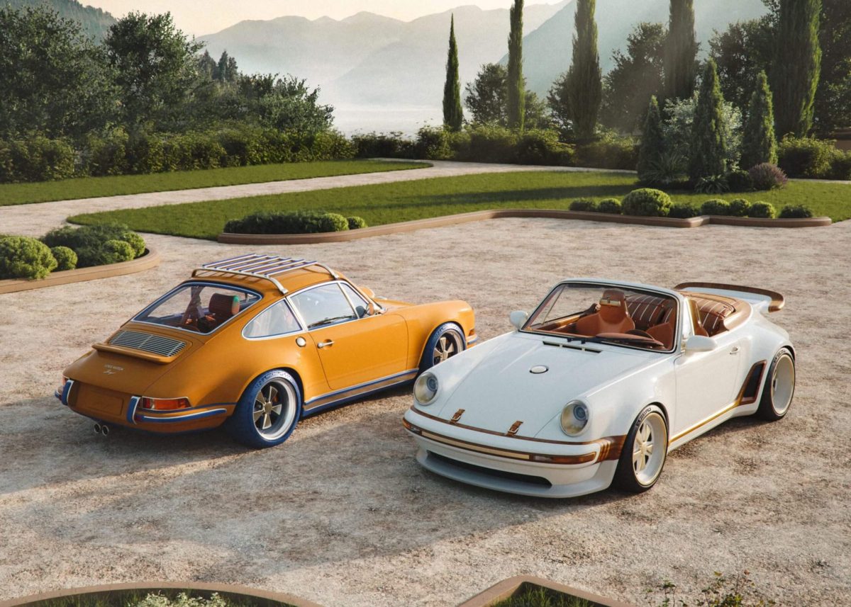 Two custom Porsche 911s displayed on a stone driveway with manicured grounds and mountains in the background