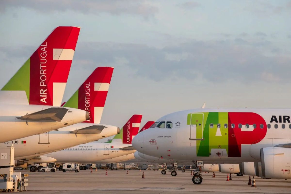TAP Air Portugal aircraft on the tarmac, showcasing the airline's distinctive livery.