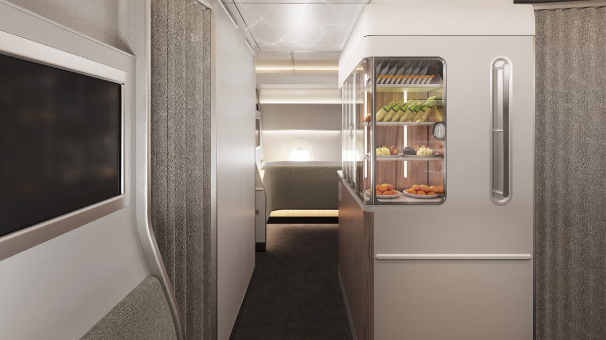 Luxurious airplane galley with fresh food and beverage display.