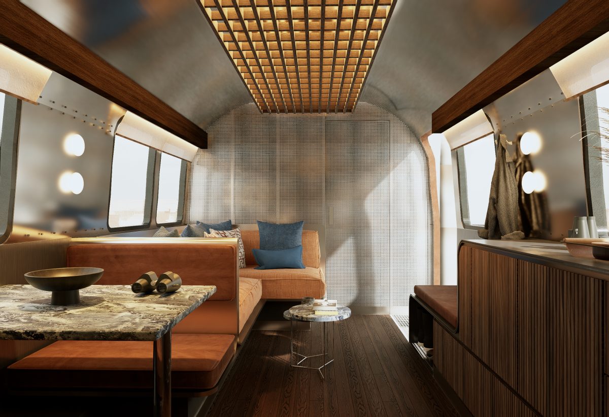 Luxurious interior of an Airstream trailer, showcasing modern design and warm tones.