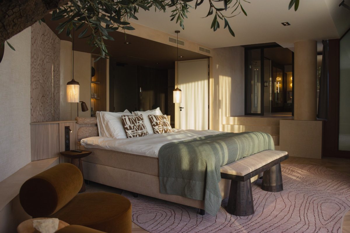 Luxurious spa resort bedroom with natural light, modern furnishings, and ambient lighting