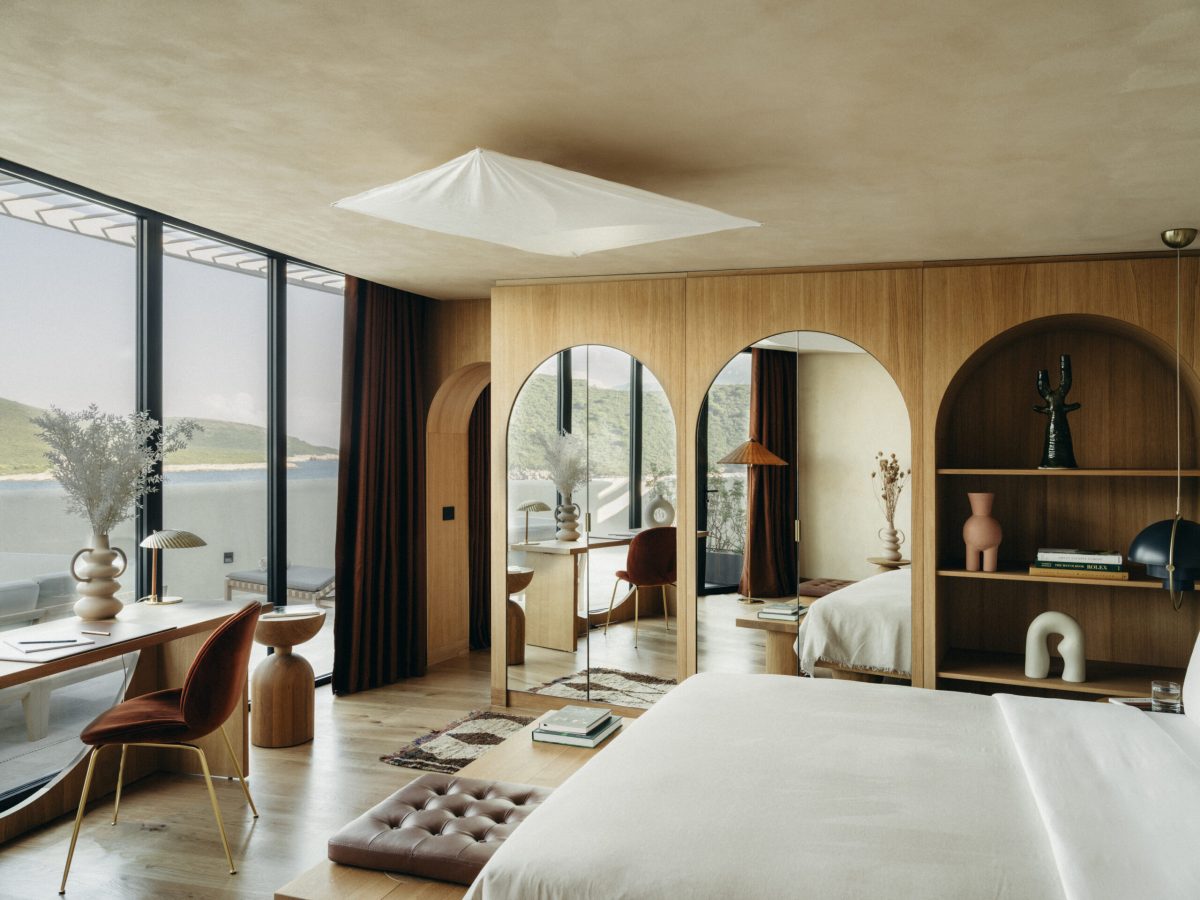 Luxury bedroom at Banyan Tree Mamula Island with wooden interiors and sea views