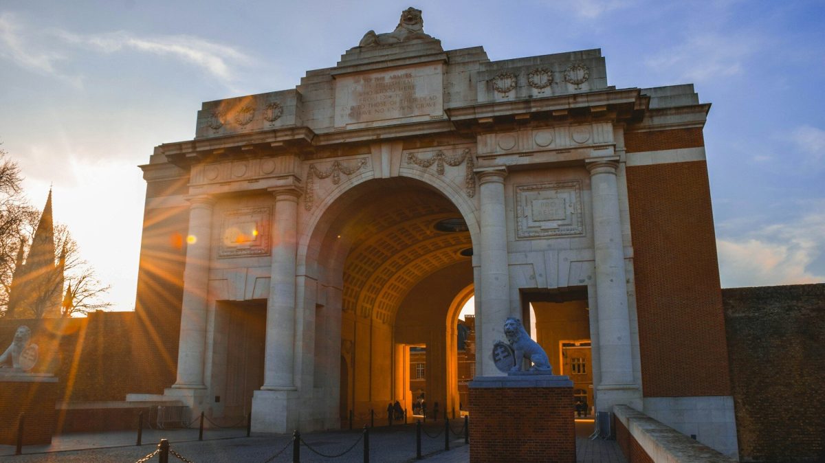 Menin Gate memorial illuminated at sunset in Ypres, Belgium
