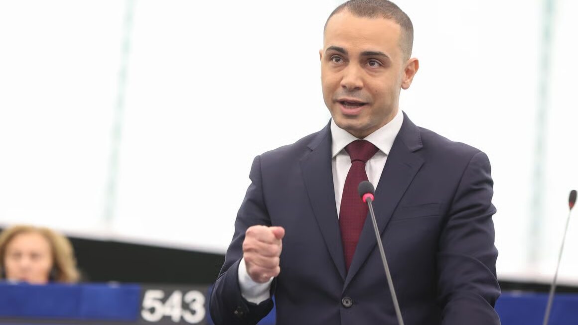 MEP speaking at European Parliament podium during debate on tourism management