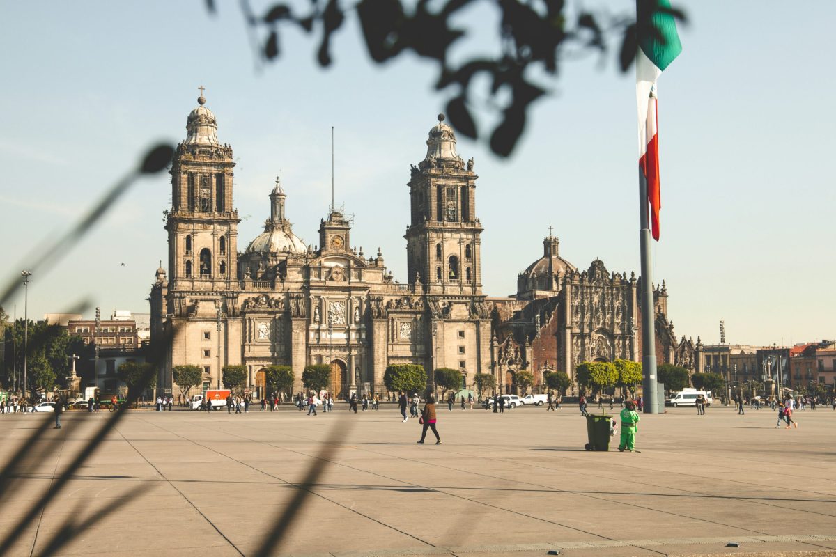 Mexico City's Metropolitan Cathedral in the Zócalo plaza with Mexican flag