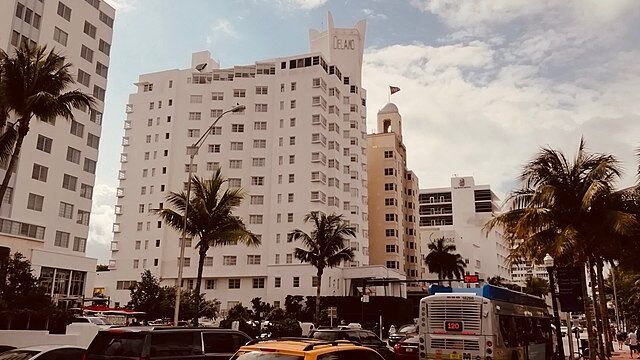 Miami skyline with art deco and modern residential towers among palm trees