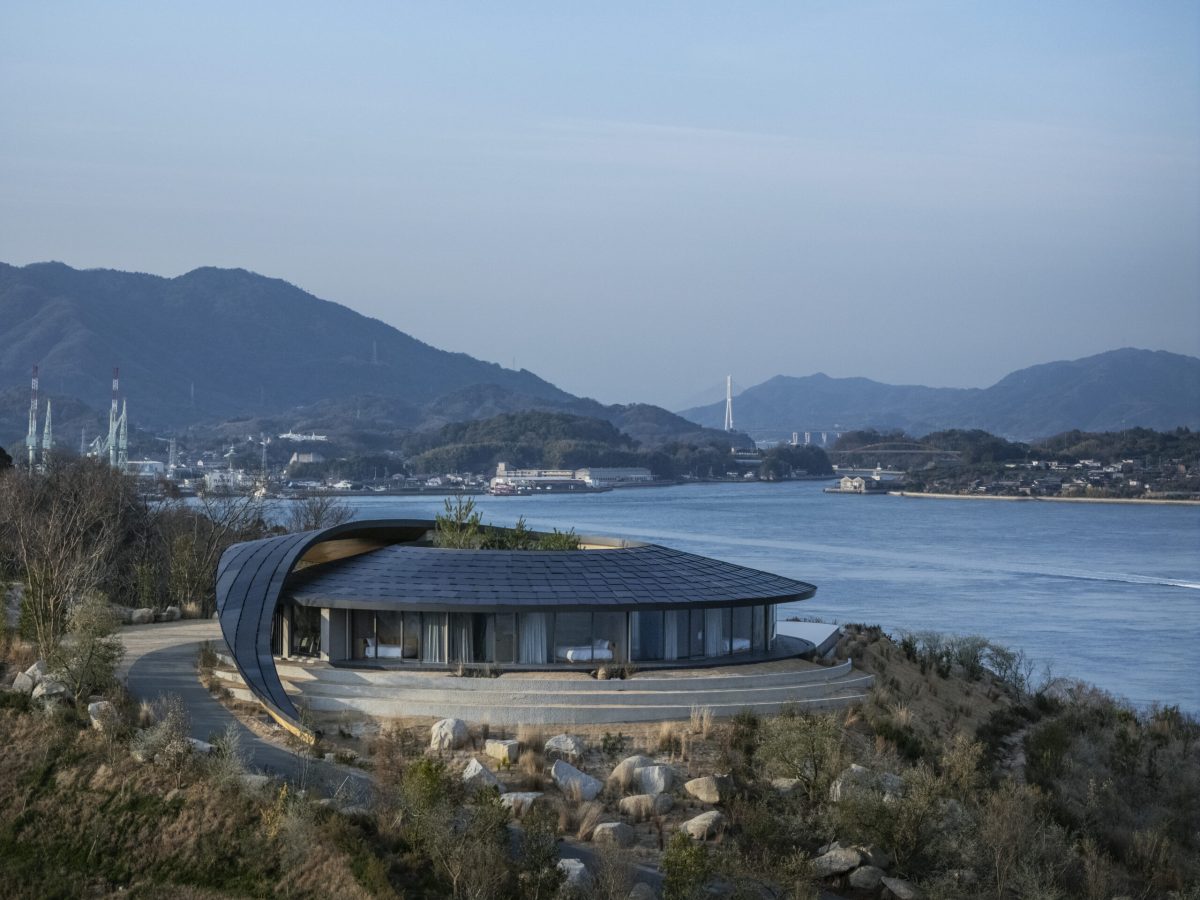 Modern curved villa with rammed earth construction overlooking Seto Inland Sea, Japan