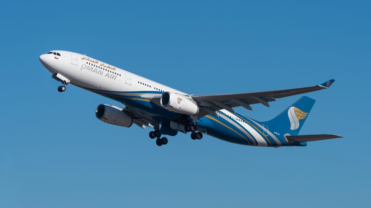Oman Air Airbus A330 aircraft in flight against clear blue sky