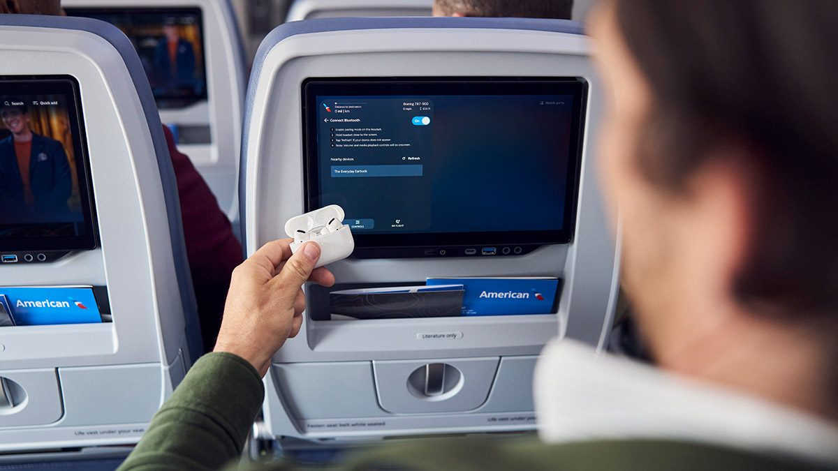 Passenger using seatback entertainment screen on American Airlines flight