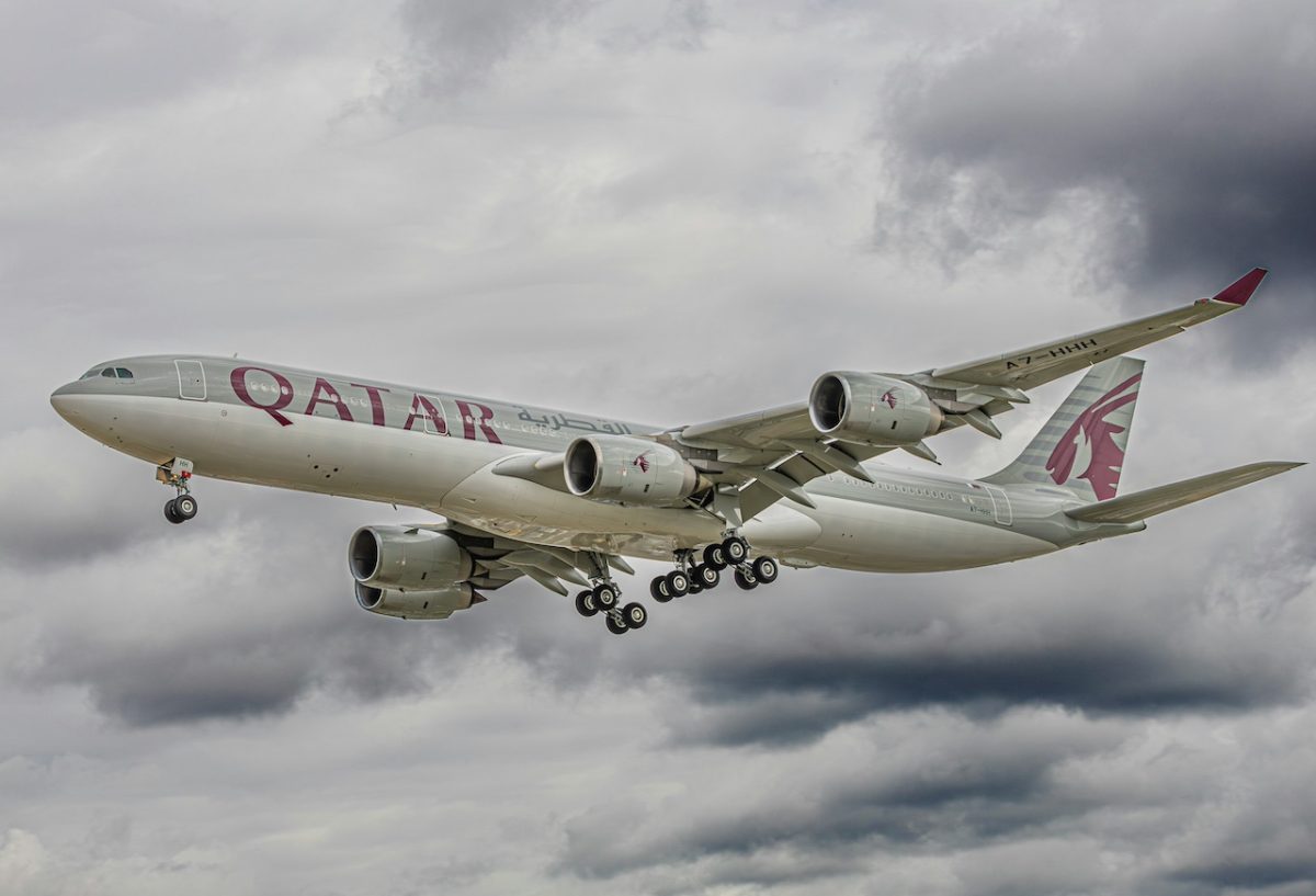 Qatar Airways Airbus A330 aircraft in flight against cloudy sky