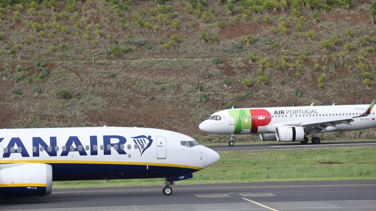 Ryanair aircraft on tarmac with TAP Air Portugal plane in background