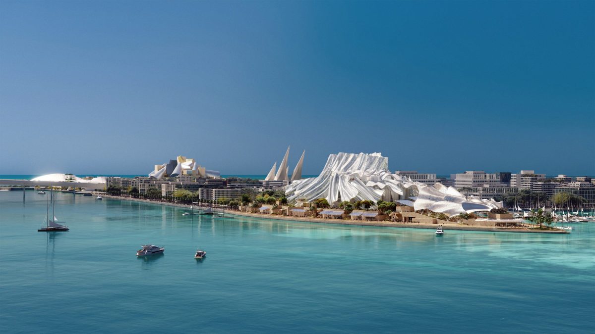 Saadiyat Island waterfront with white sail-shaped building and turquoise waters under blue sky