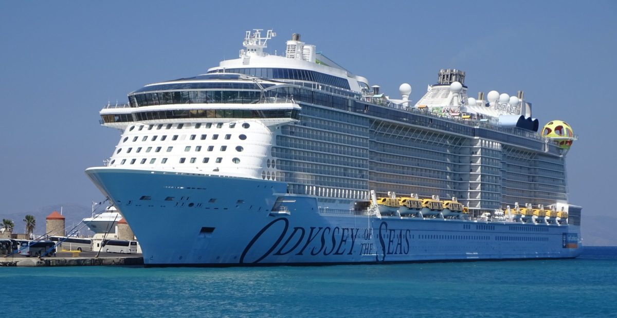 Royal Caribbean's Odyssey of the Seas cruise ship sailing on a clear blue sea.