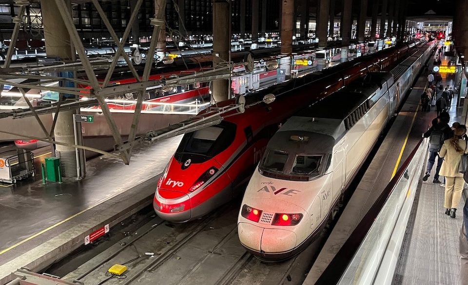 High-speed trains at a station, reflecting the tragedy of Spain's rail disaster.