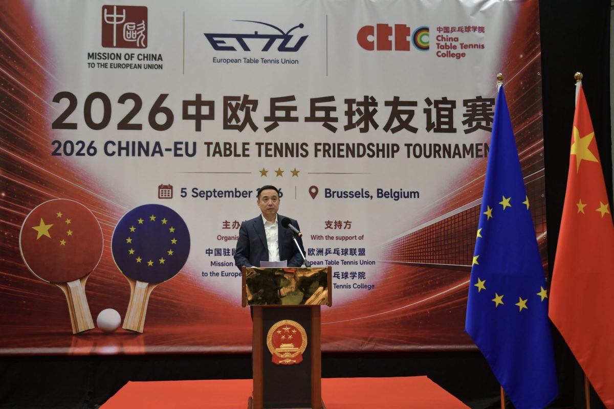 Speaker at podium during 2026 China-EU Table Tennis Friendship Tournament in Brussels