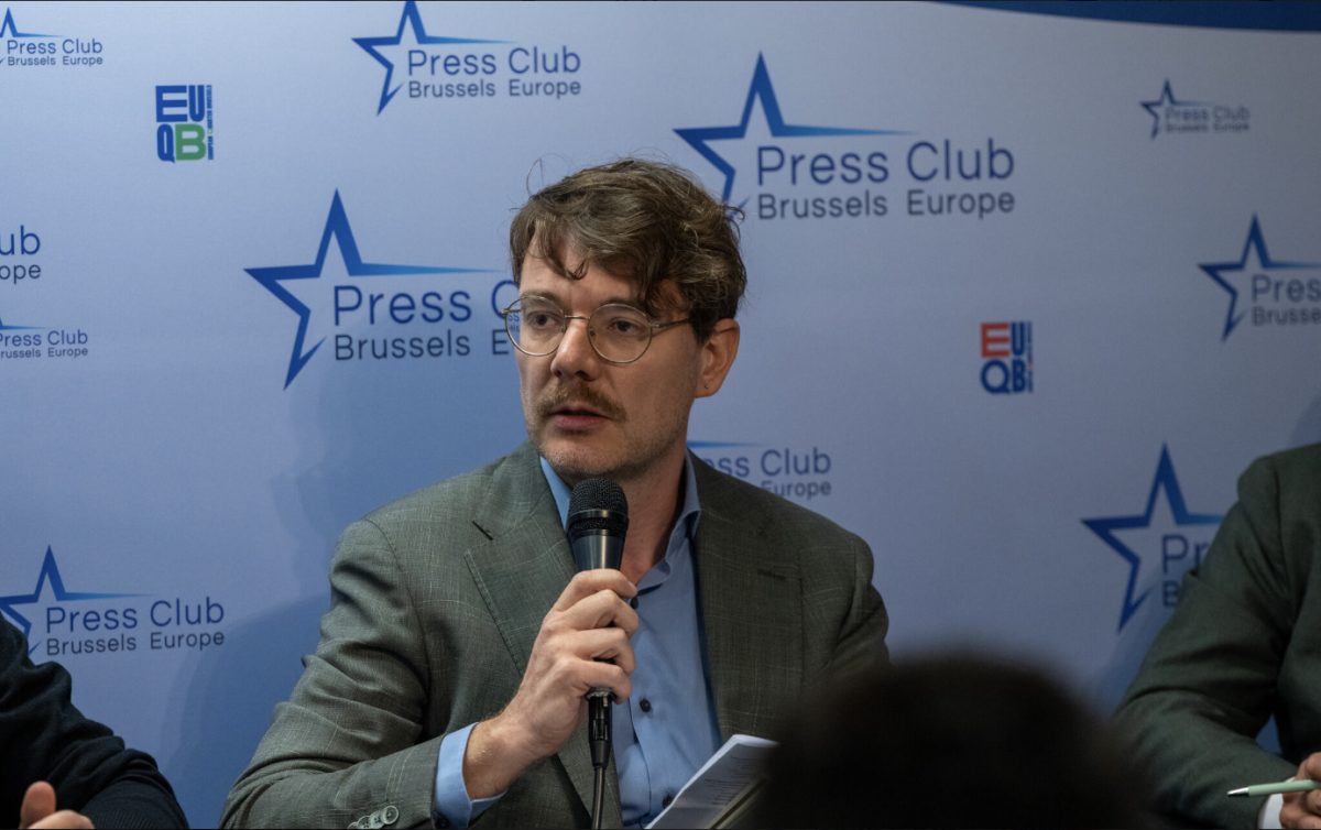 Speaker at Press Club Brussels Europe conference discussing climate action